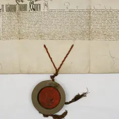 Stary dokument z pieczęcią. Litery i tekst w języku łacińskim, jakby nic się nie zmieniło przez wieki.