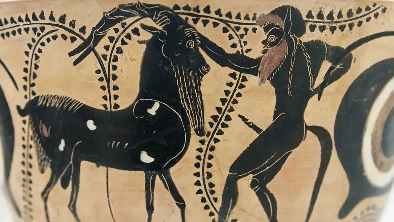Czarny satyr z brodą i ogonem walczy z kozłem.
