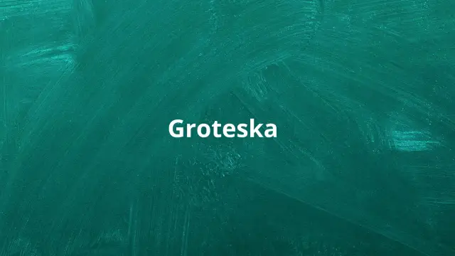 Biały napis "Groteska" na zielonej tablicy. Co to groteska? To styl, który łączy elementy śmieszne i straszne, tworząc niepokojący efekt.